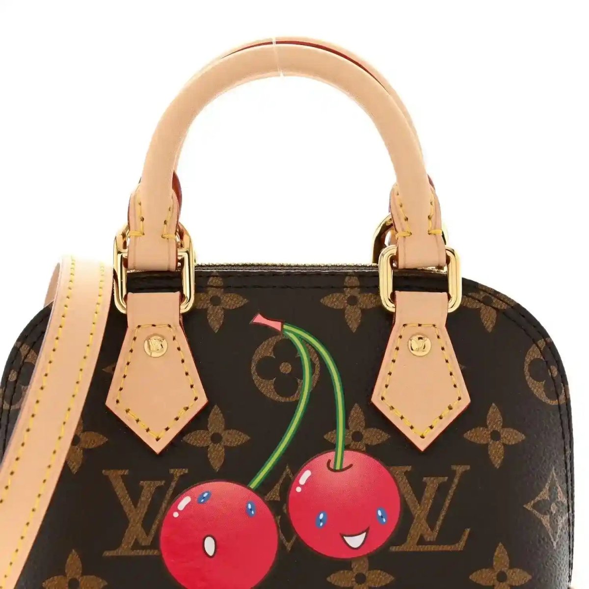 Mini tote handbag front with dark monogram canvas, tan handles, cherry graphic