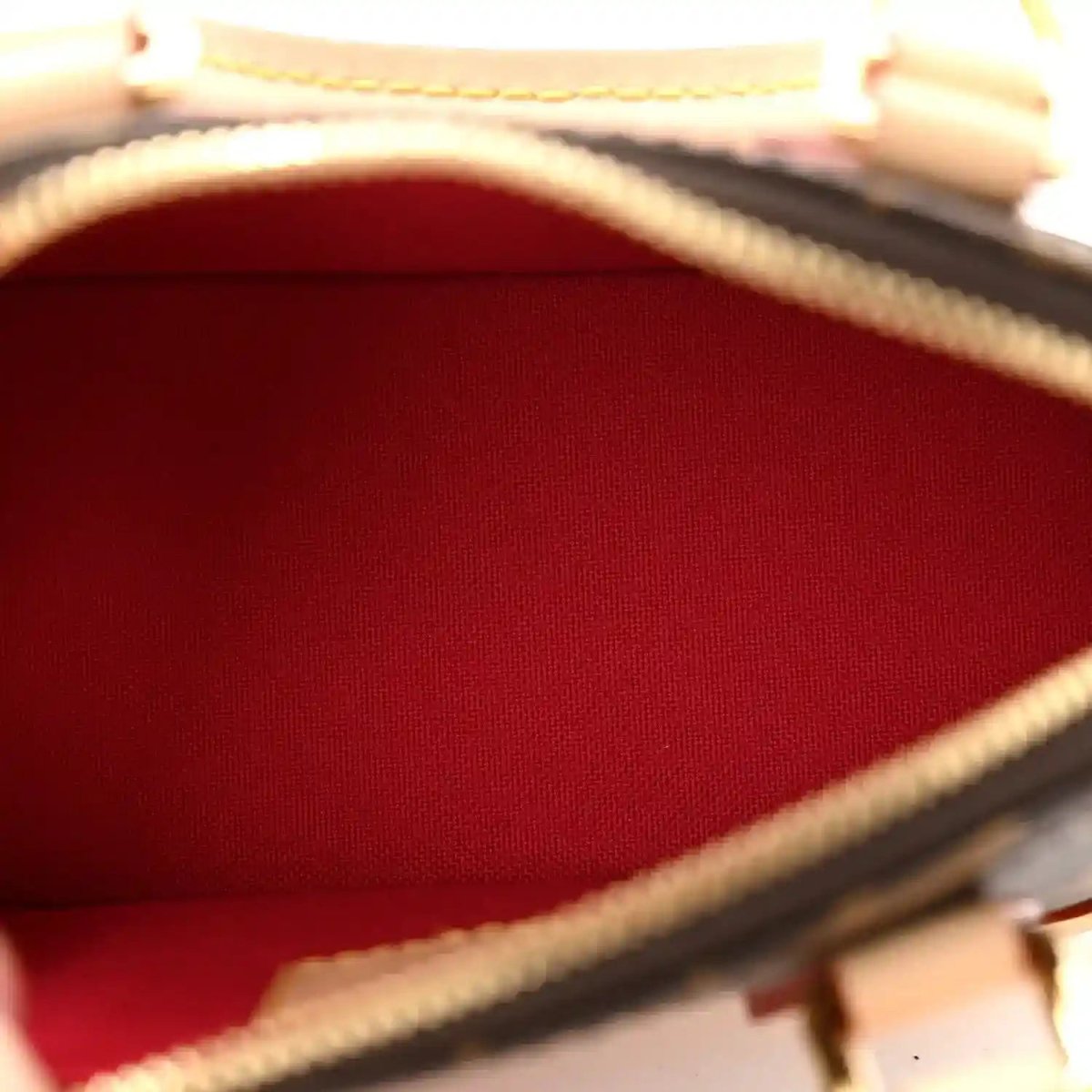 Mini handbag interior lining with red fabric and tan leather edge