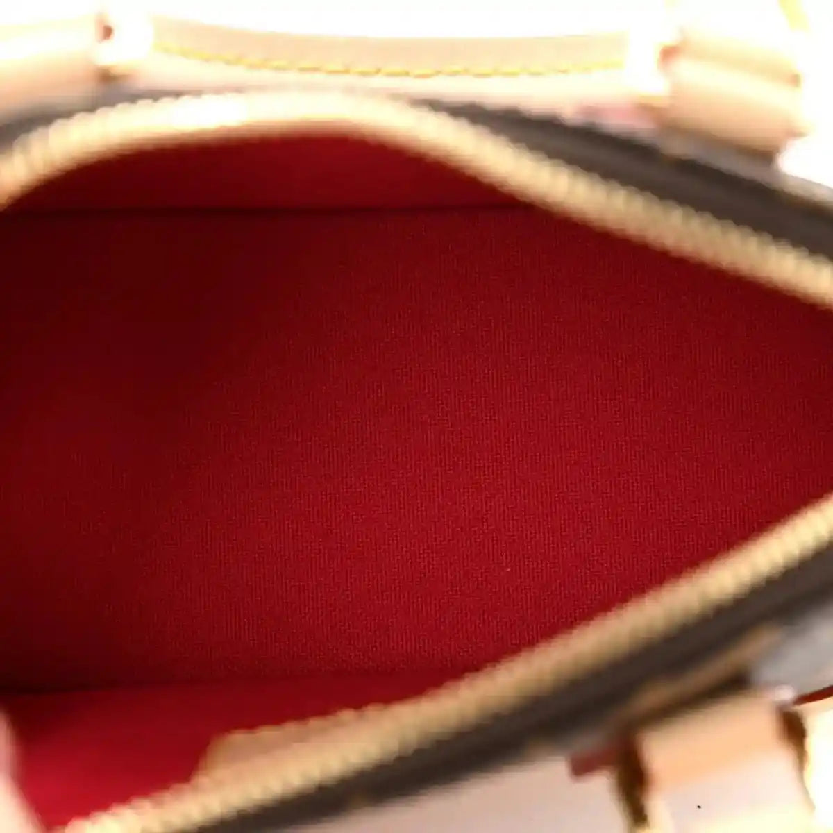 Mini handbag interior lining with red fabric and tan leather edge