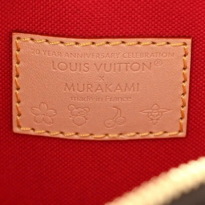 Louis Vuitton anniversary leather patch on red fabric reading 'MIRAKAMI'