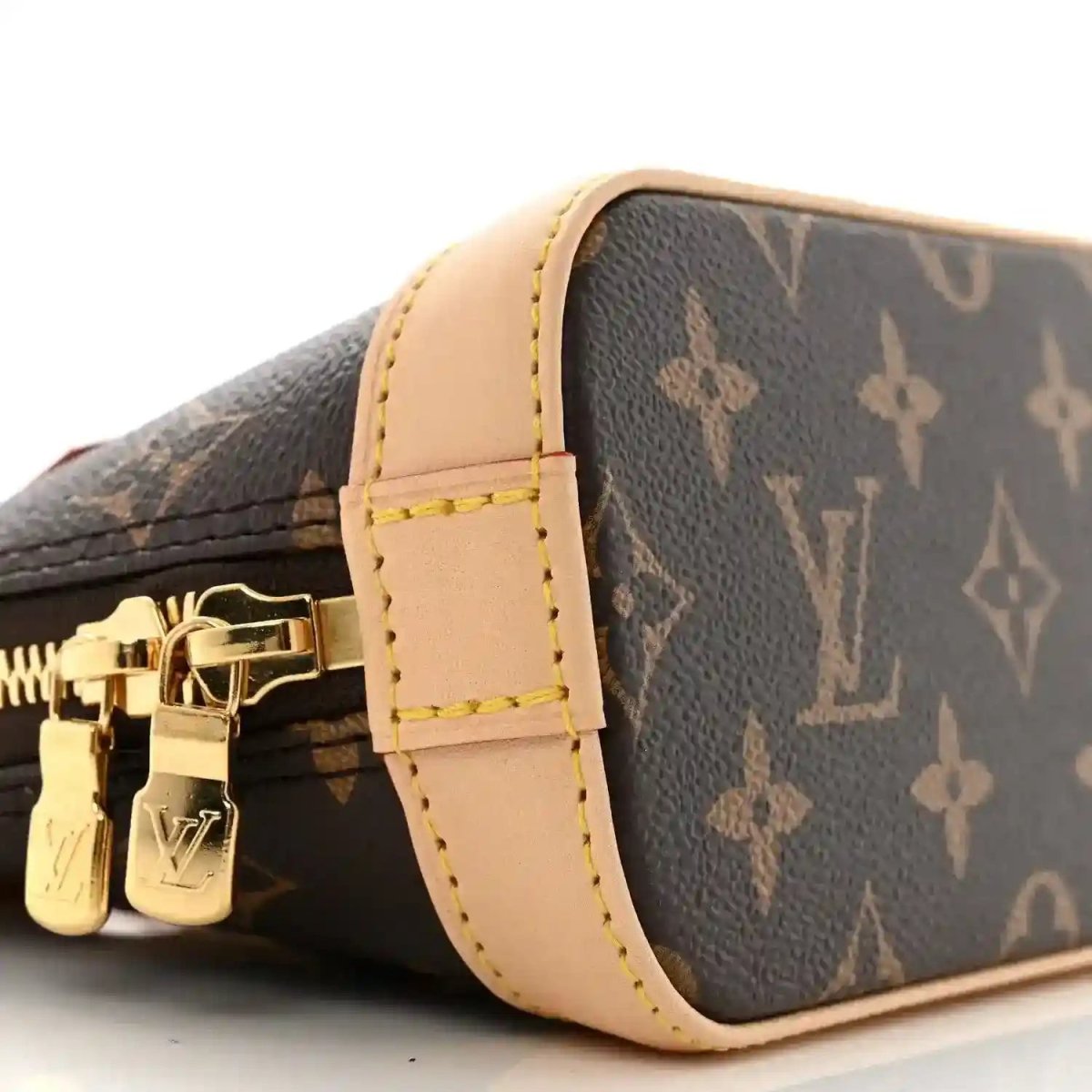 Mini crossbody bag with dark monogram canvas, tan trim, gold hardware
