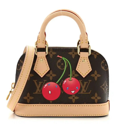 Mini tote handbag with dark monogram canvas, tan leather trim, cherry motif