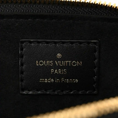 Louis Vuitton label patch with “Louis Vuitton Paris made in France” on black lining