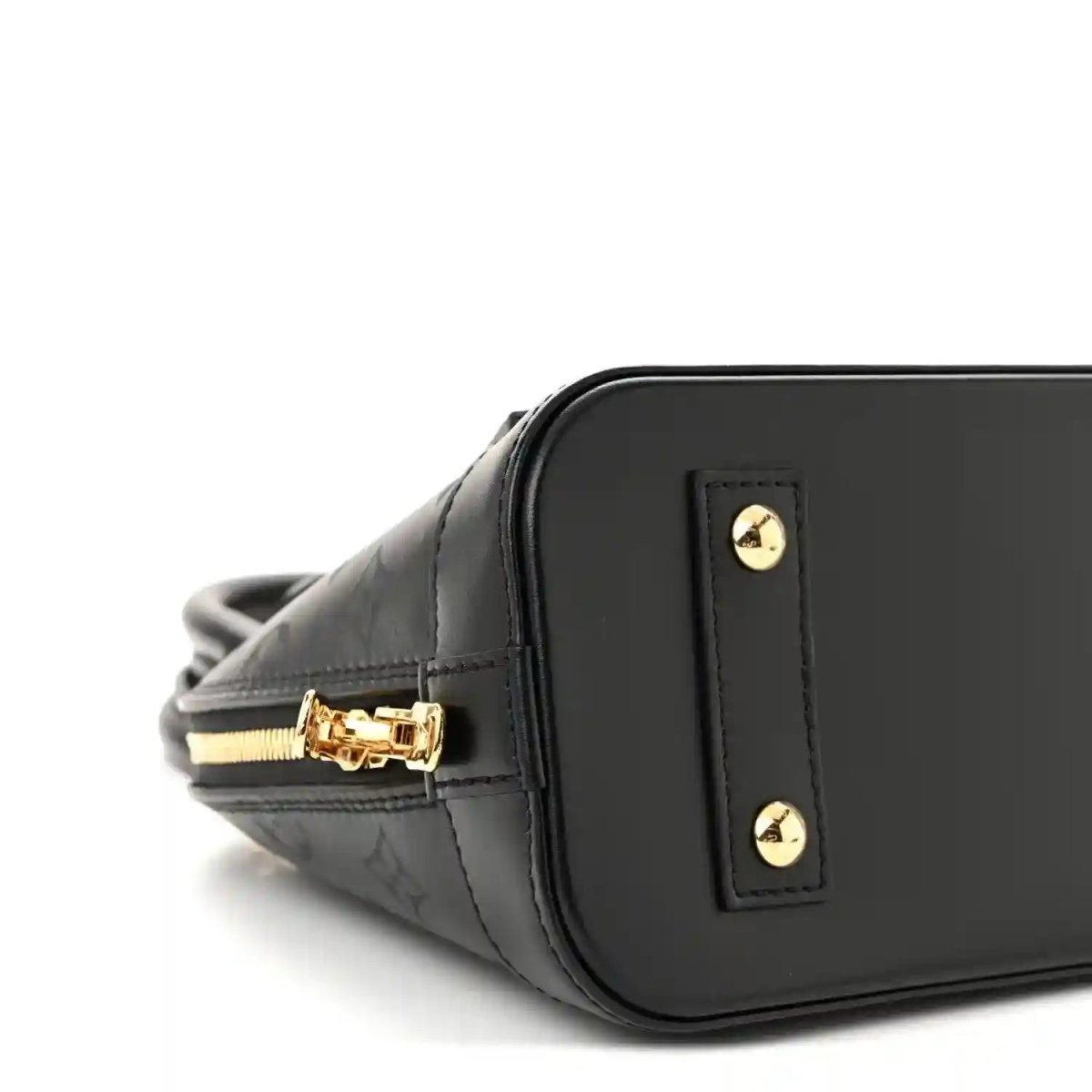 Louis Vuitton Alma BB handbag close-up, black embossed leather with gold logo plaque