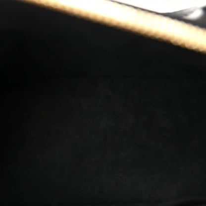 Louis Vuitton Alma BB handbag, close-up of black embossed calfskin texture