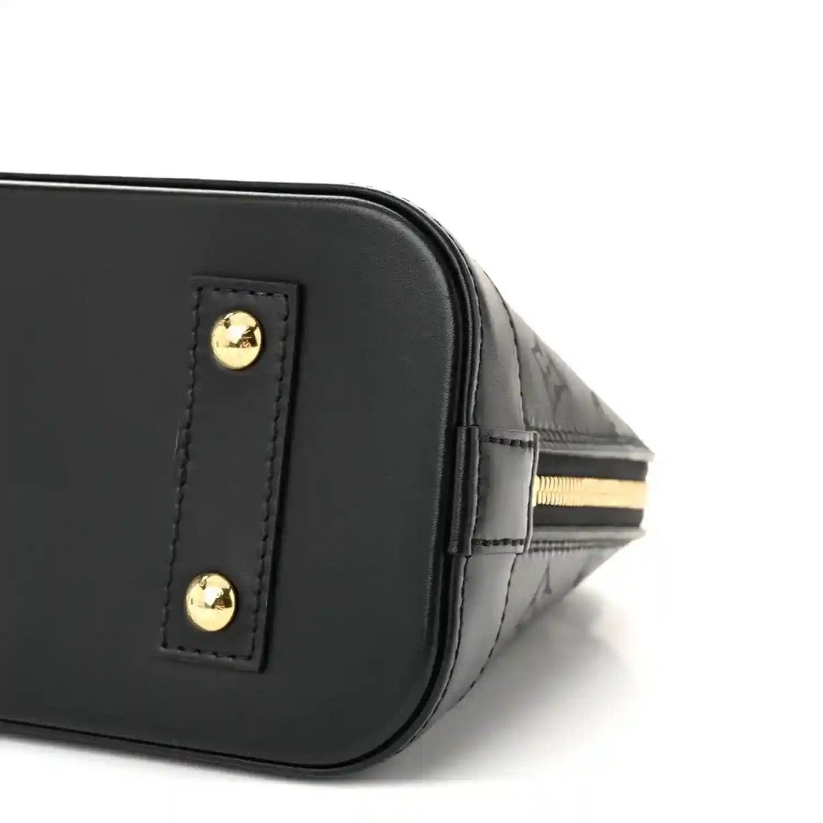 Louis Vuitton Alma BB handbag corner close-up, black leather with gold hardware button