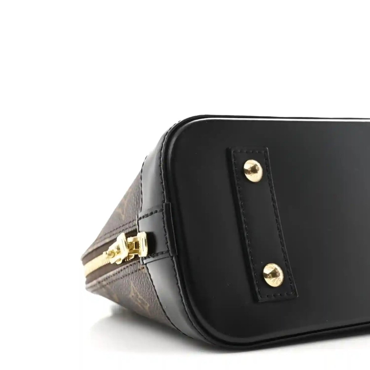 Small monogram tote side close-up with gold zipper pull and black front panel