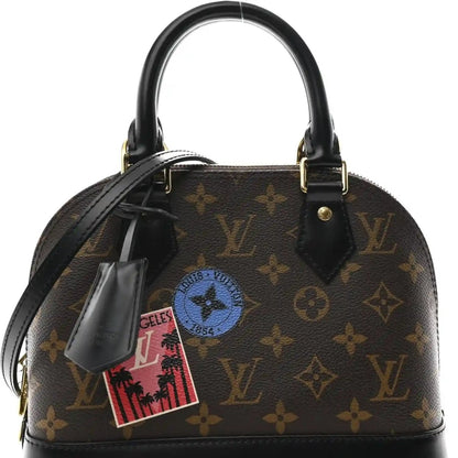 Small monogram tote front view with dark brown canvas, black handles, and gold hardware