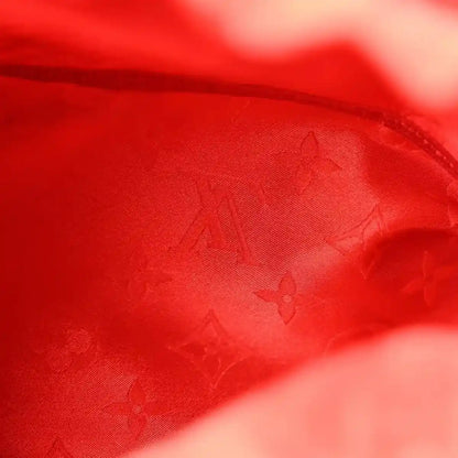 Red interior lining with monogram pattern, close-up textile texture