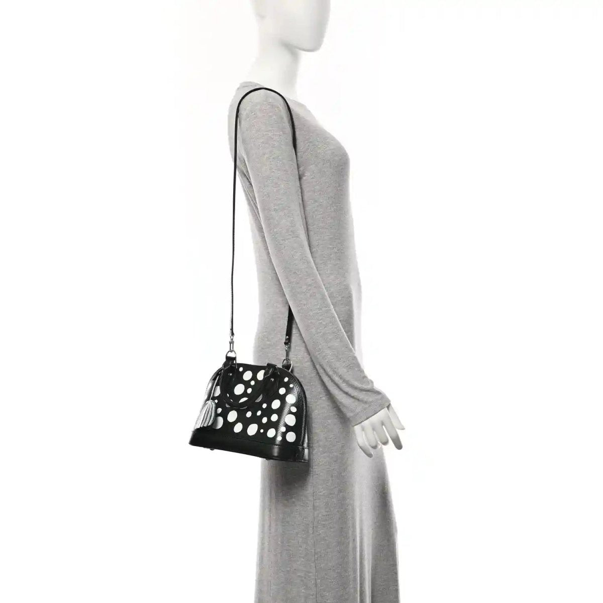 Alma BB bag with white polka dots, small top zipper, long crossbody strap and charm