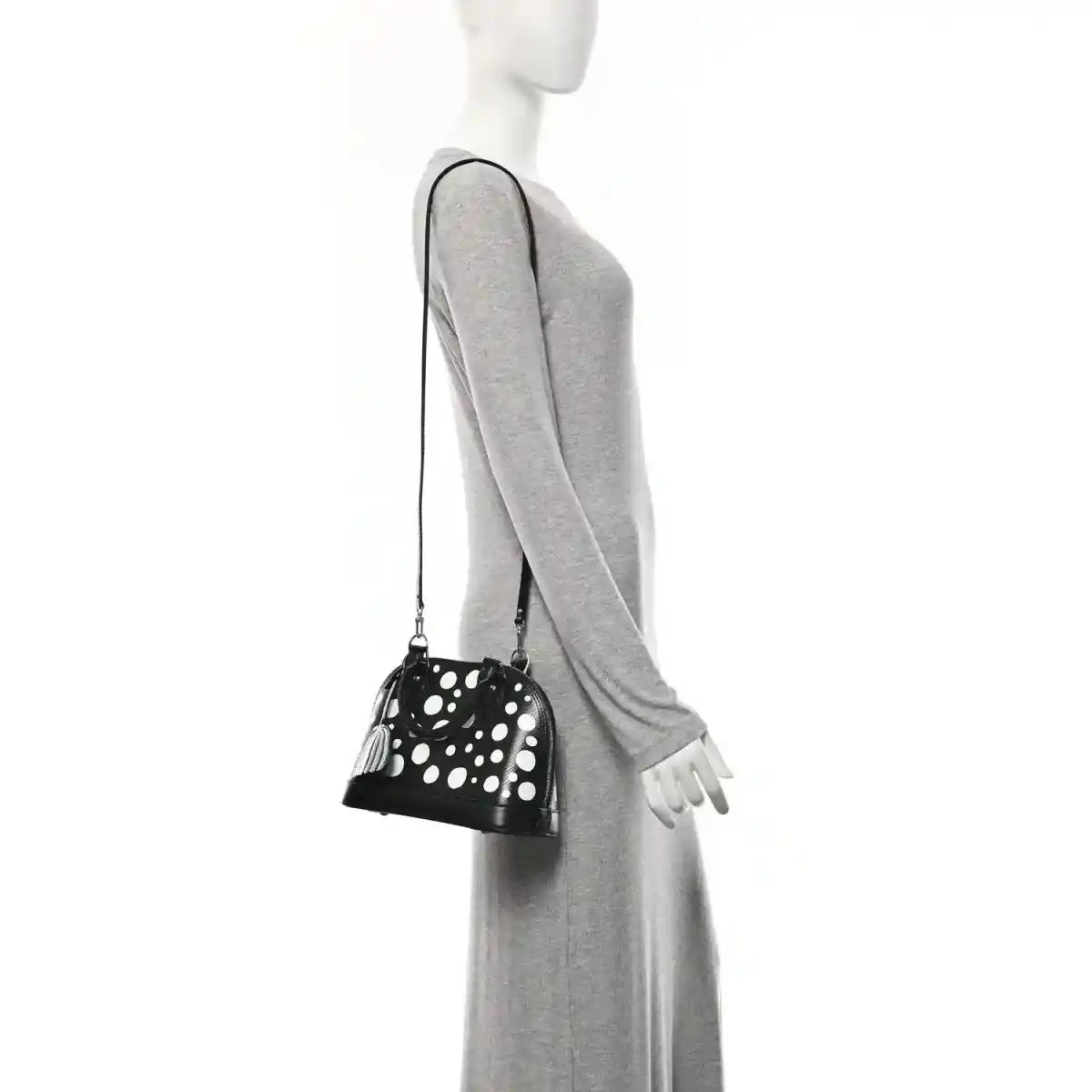 Alma BB bag with white polka dots, small top zipper, long crossbody strap and charm