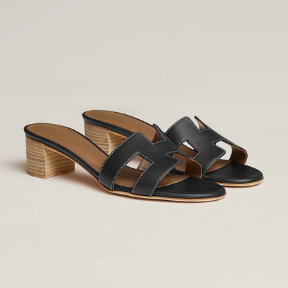 Hermès Oasis sandal in black leather, open-toe slide with block heel and H-shaped straps