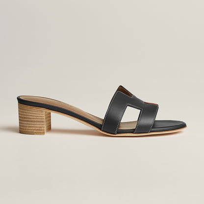 Hermès Oasis sandal in black leather, open-toe slide with block heel and top strap detail