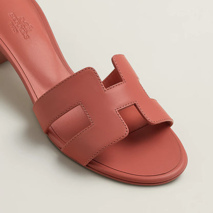 Hermès Oasis slide sandal with cutout strap details, rose red, block heel