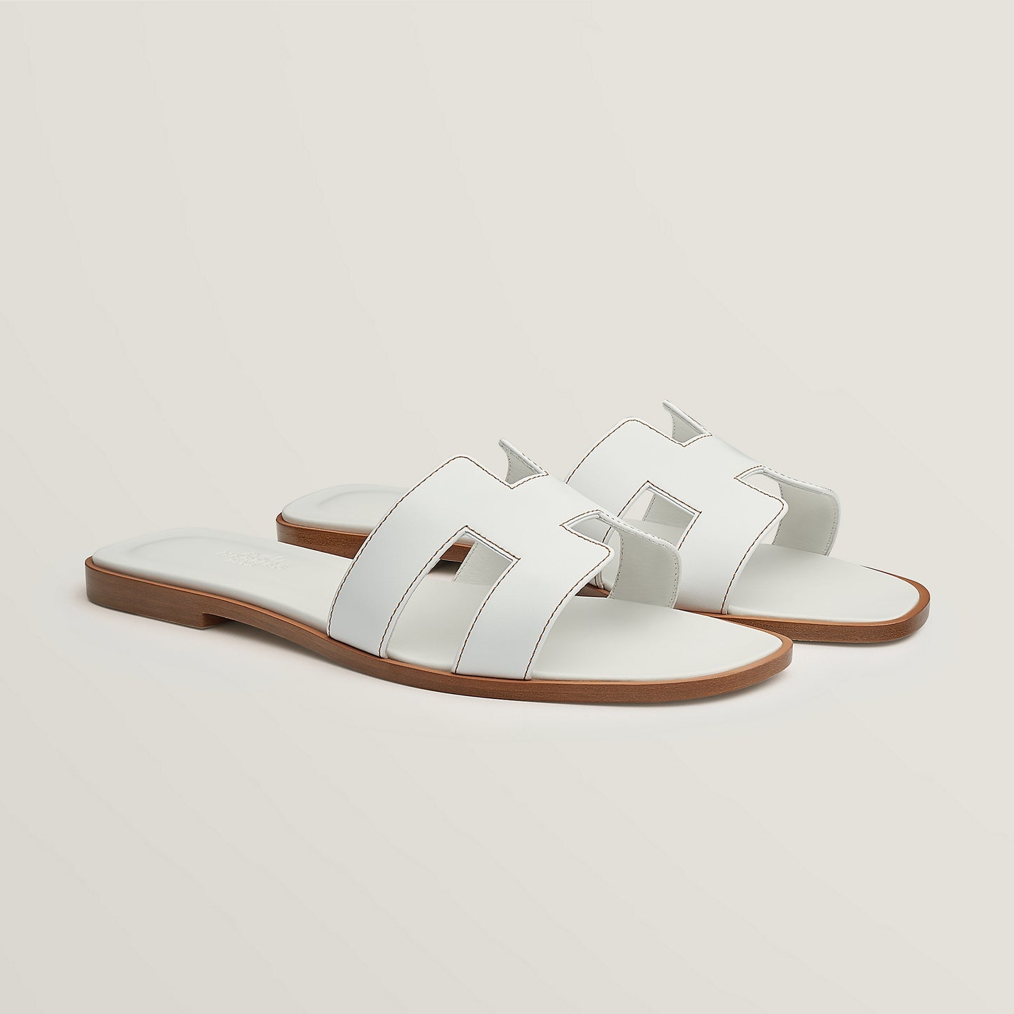 Hermès Oran slide sandal, white leather, open square toe, flat brown sole