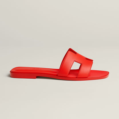 Hermès Oran slide sandal, red leather, single slide strap, flat red sole