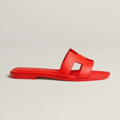 Hermès Oran slide sandal, red leather, single slide strap, flat red sole