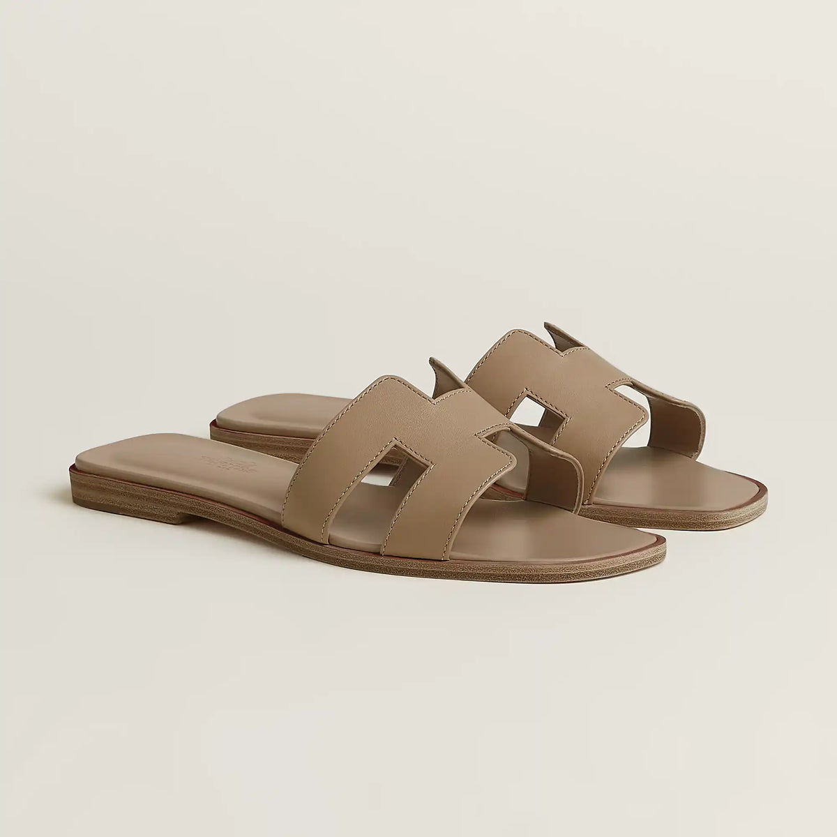 Hermès Oran slide sandal, beige/taupe leather, open square toe, flat brown sole