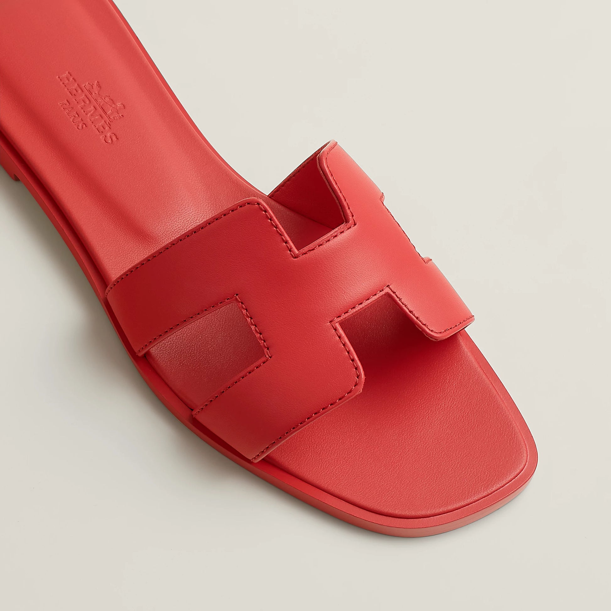 Hermès Oran red leather slide sandal with stitched front straps