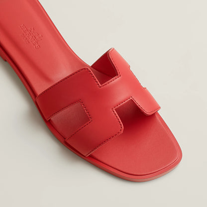Hermès Oran red leather slide sandal with stitched front straps