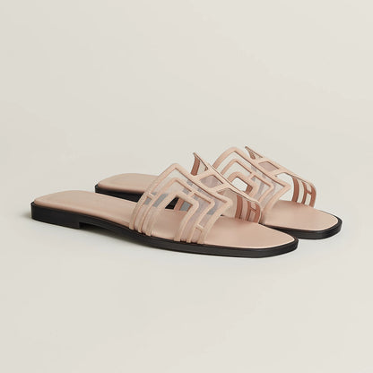 Hermès Oran leather slide sandals in beige, pair with cutout straps