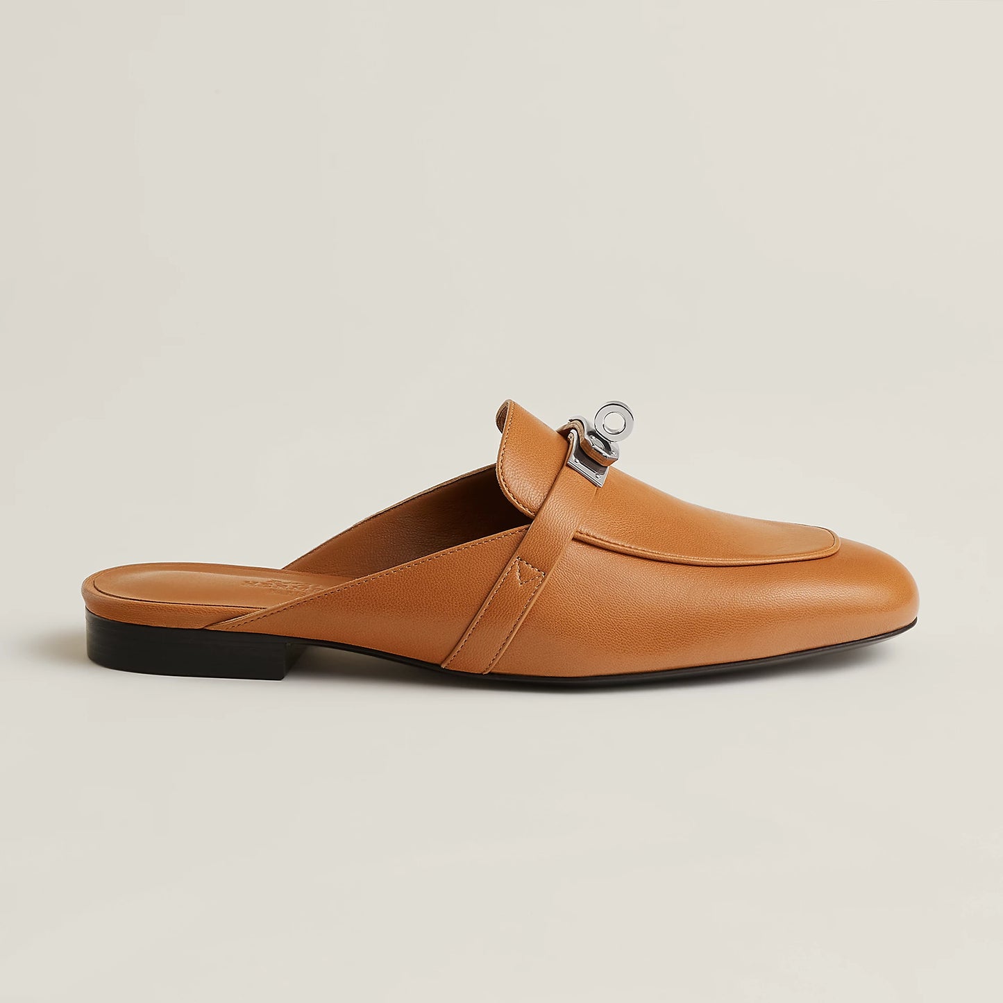 Hermès Oz goatskin mule, tan slip-on with silver-tone buckle and rounded toe