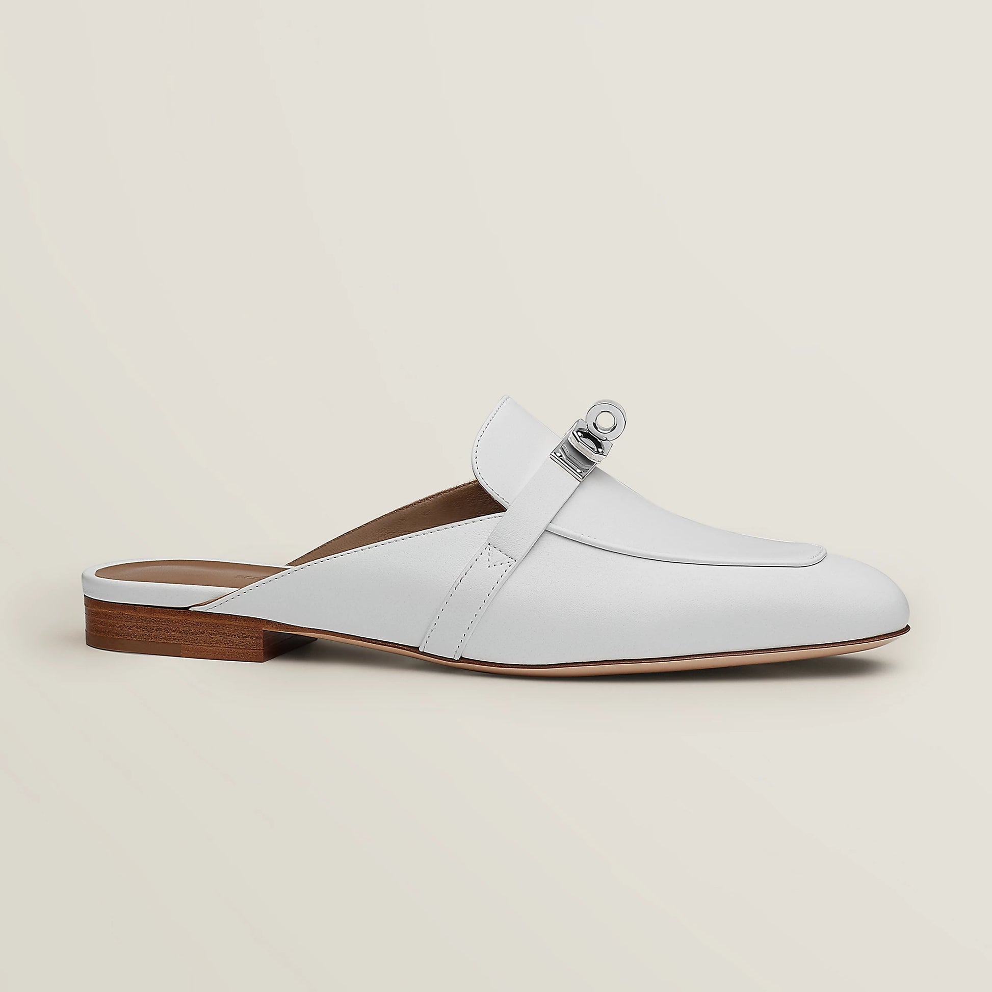 White leather mule with side buckle strap and low wooden-look block heel