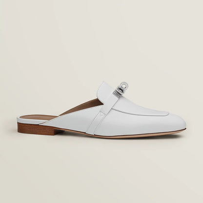 White leather mule with side buckle strap and low wooden-look block heel