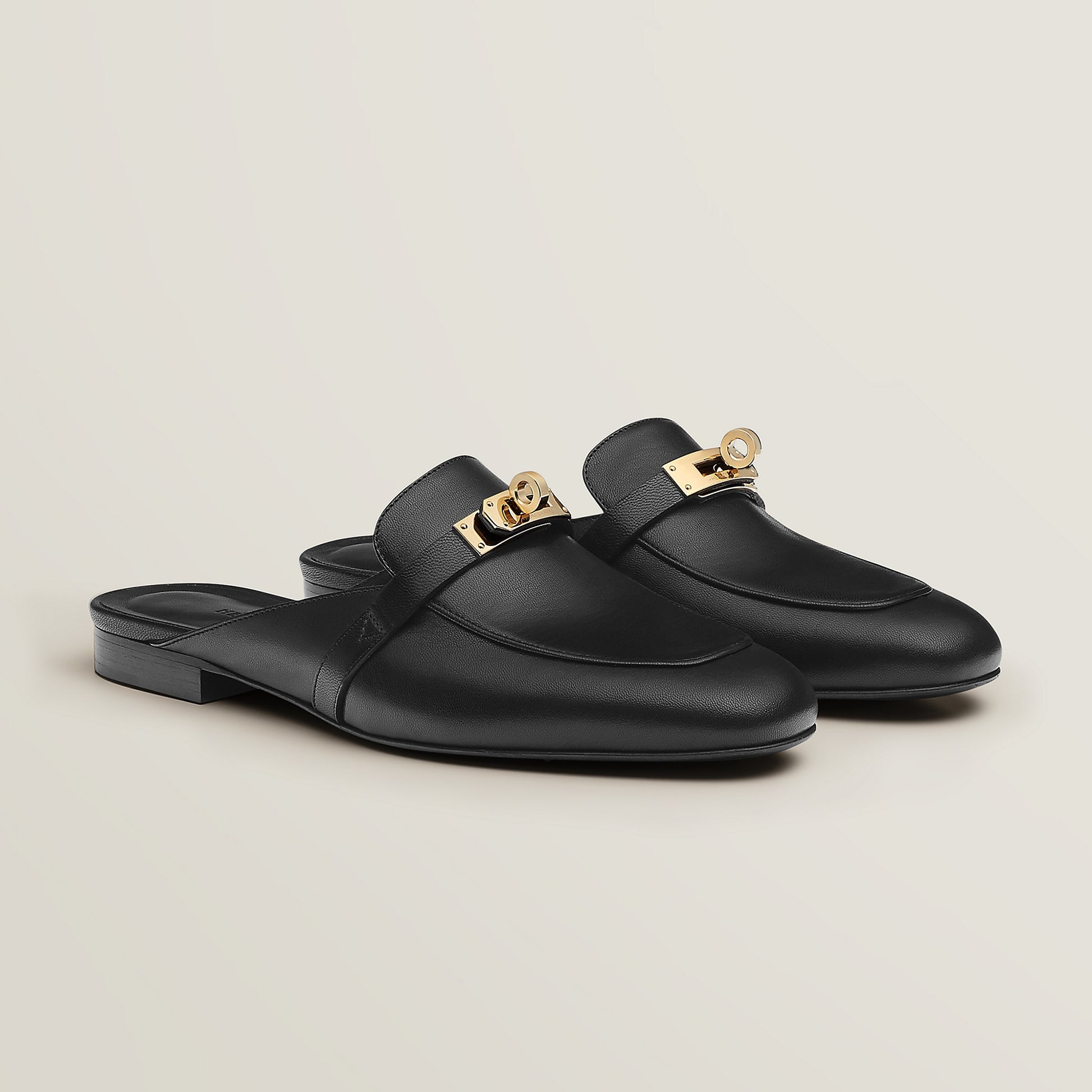 Hermès Oz goatskin mule, black leather with gold-tone buckle and low heel