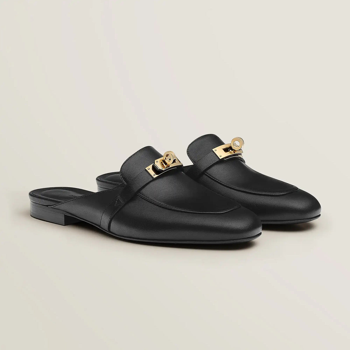 Hermès Oz goatskin mule, black leather with gold-tone buckle and low heel