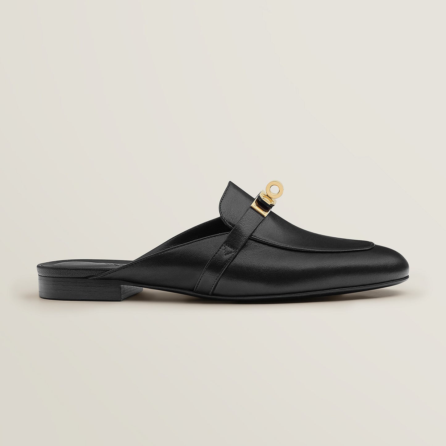 Hermès Oz goatskin mule, black leather with gold-tone buckle and flat heel