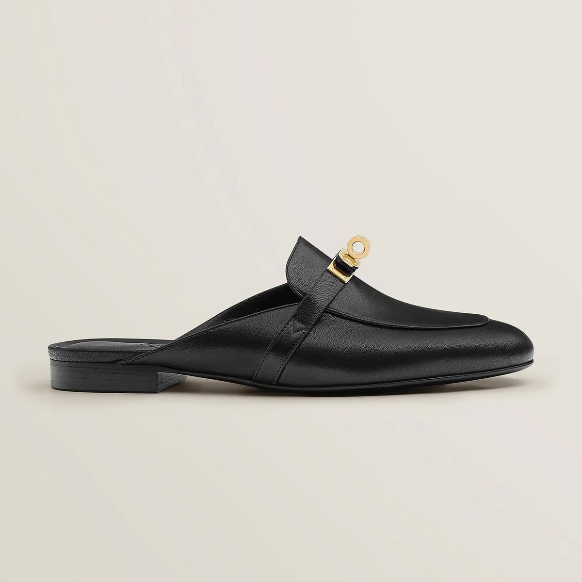 Hermès Oz goatskin mule, black leather with gold-tone buckle and flat heel