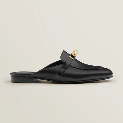 Hermès Oz goatskin mule, black leather with gold-tone buckle and flat heel
