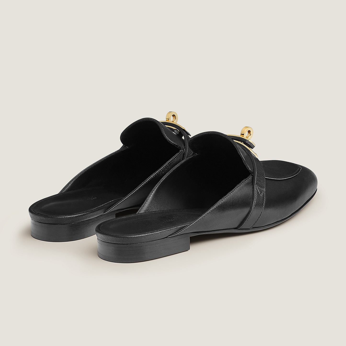 Hermès Oz goatskin mule, black leather with gold-tone buckles and rounded toe