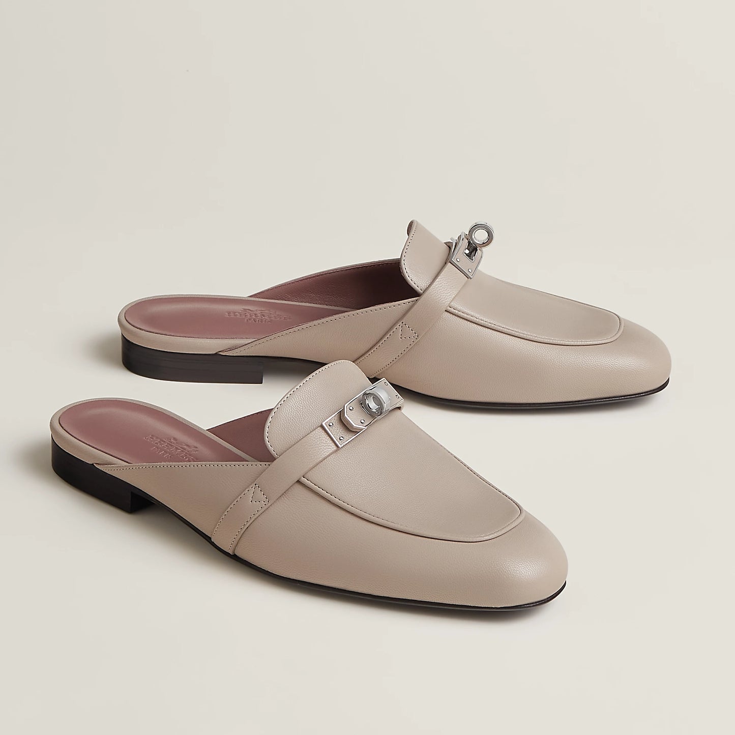 Beige leather mule flats with side buckle strap and dark low block heel