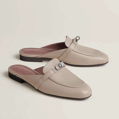 Beige leather mule flats with side buckle strap and dark low block heel