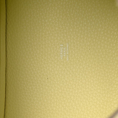 Hermes stamped on yellow leather lining of two-tone handbag.