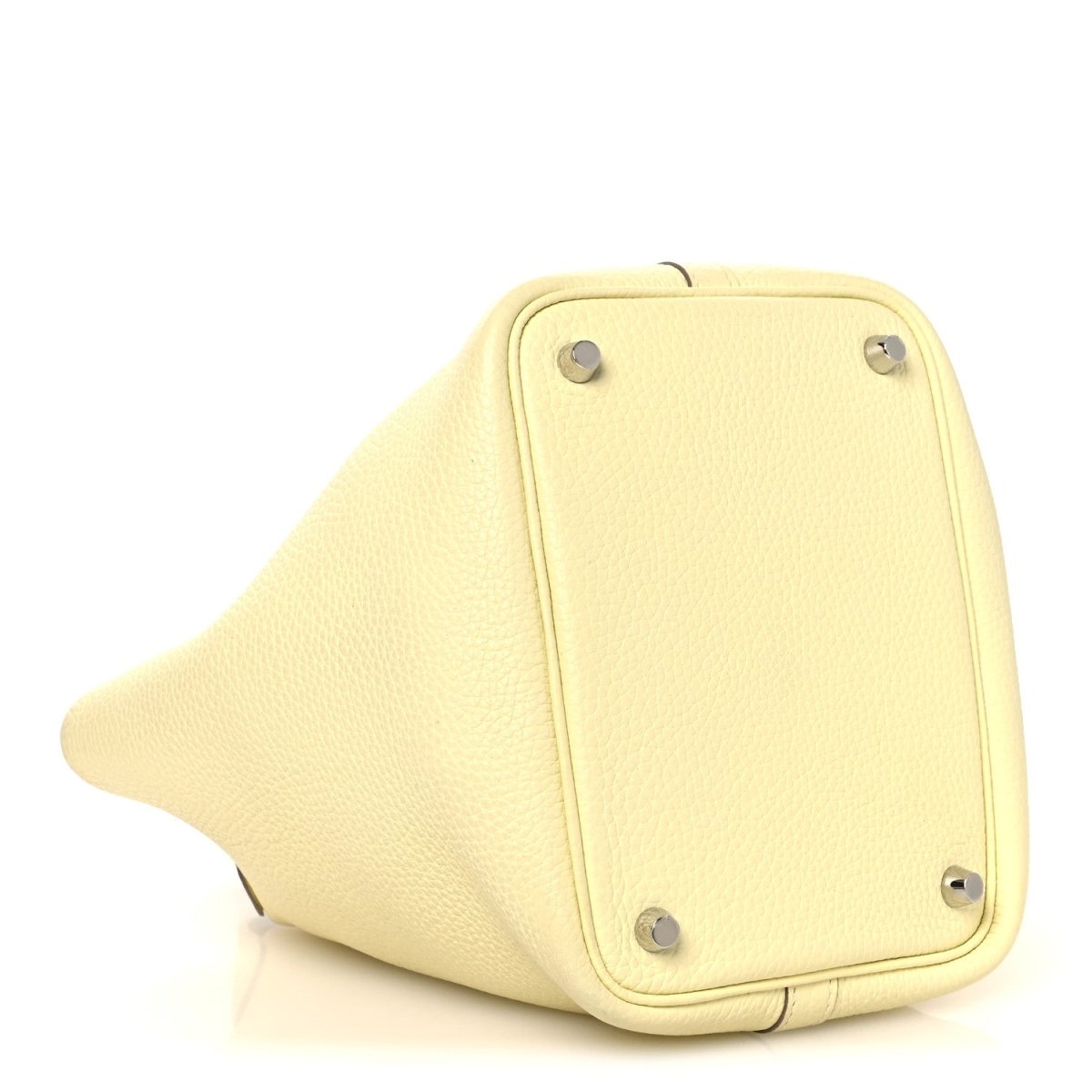 Two-tone leather handbag bottom panel in yellow with metal feet and corner hardware.