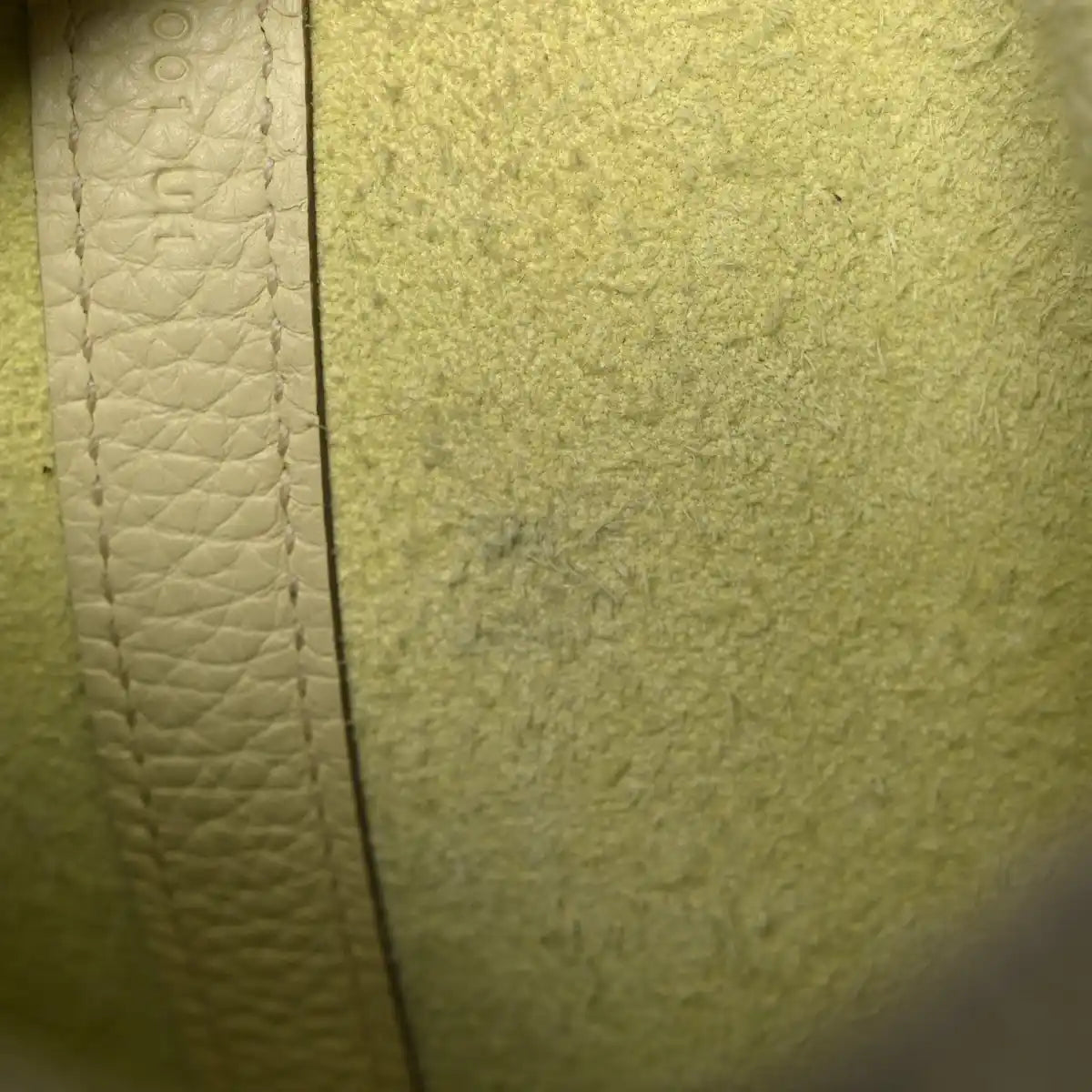 Two-tone calfskin handbag, close-up side panel with textured leather
