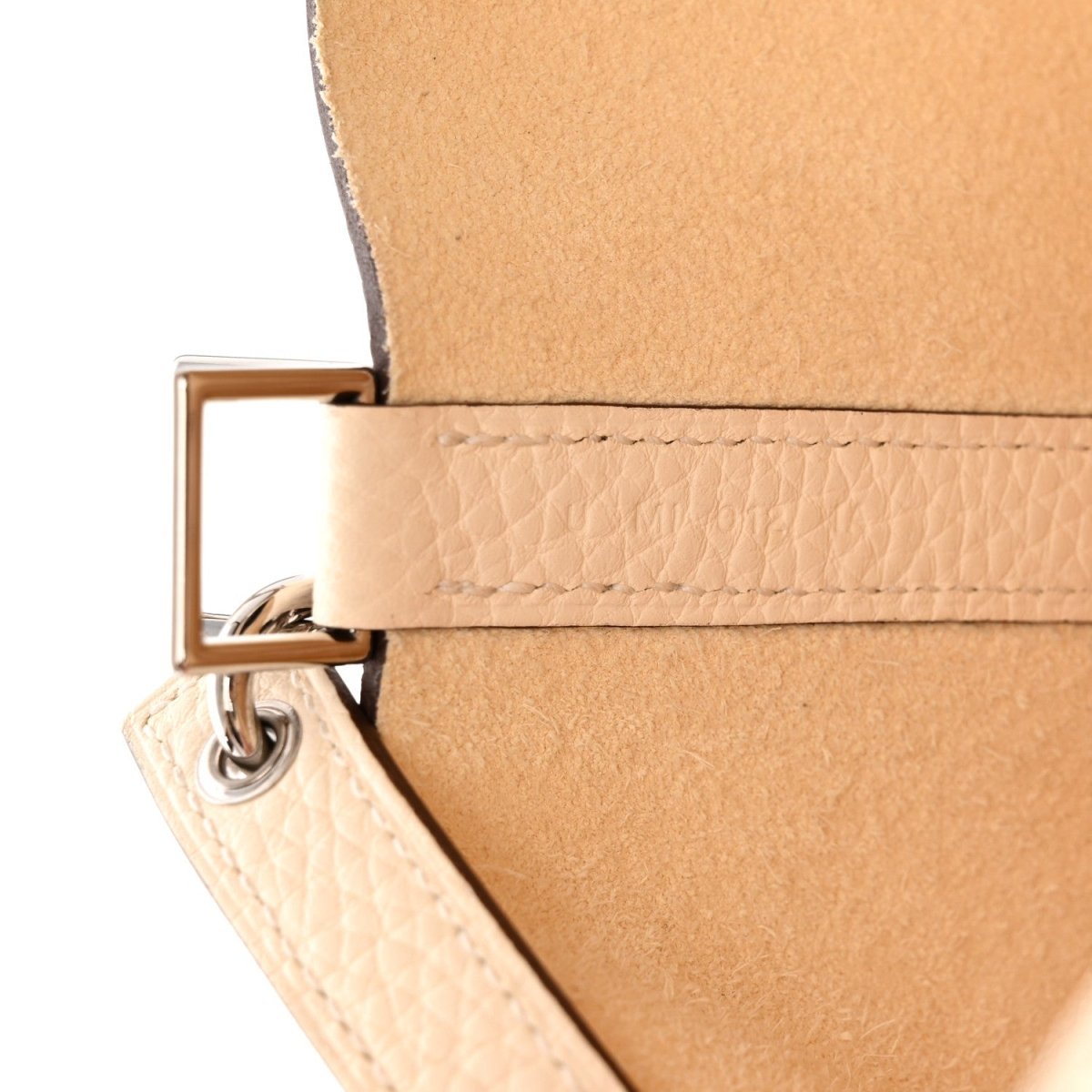 Leather handbag strap detail with metal ring and rectangular clasp