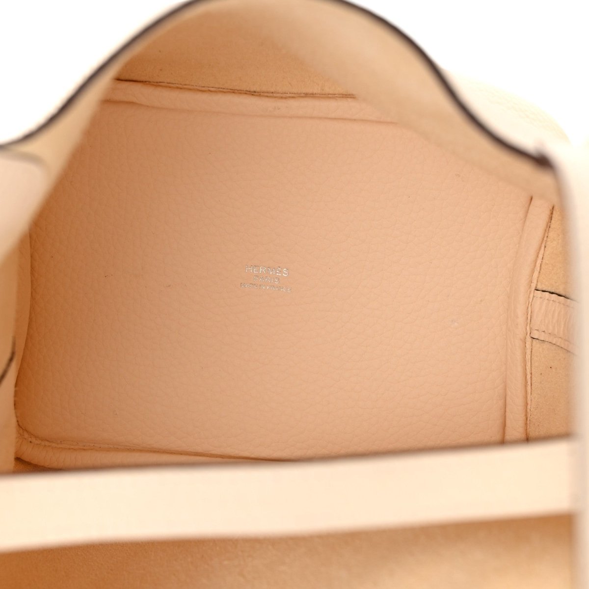 Nata leather handbag interior with stamped logo and stitched seams