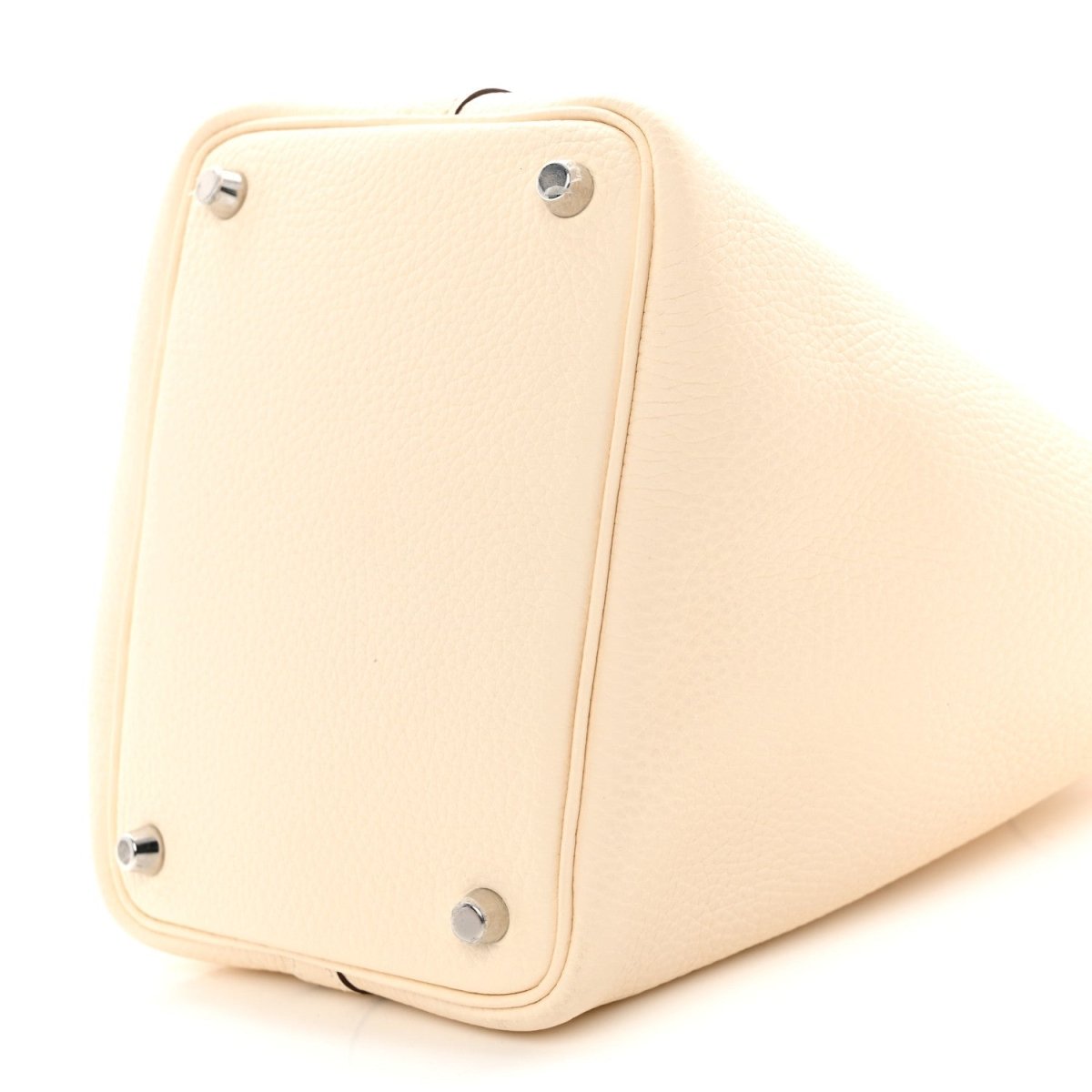 Nata leather handbag with corner hardware and smooth textured body