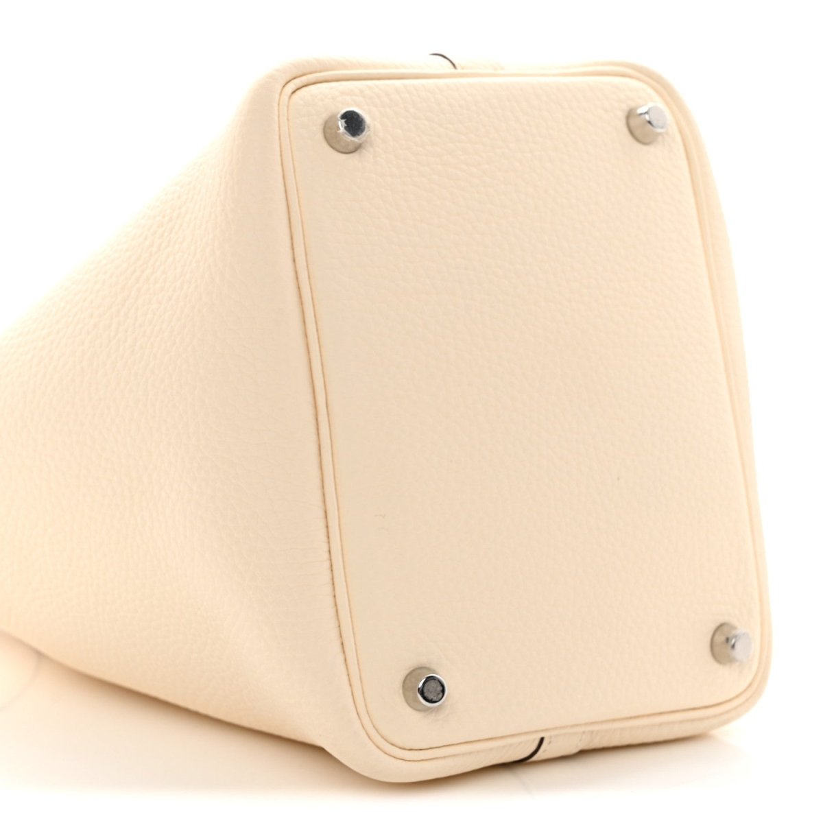 Nata leather handbag with metal stud feet and rounded back panel