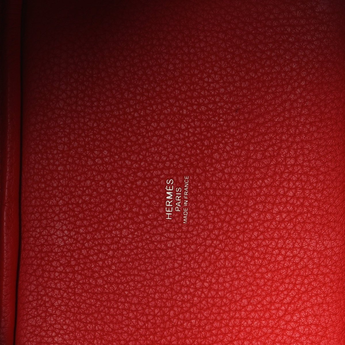 Red textured leather lining with “Hermès Paris” embossed logo.