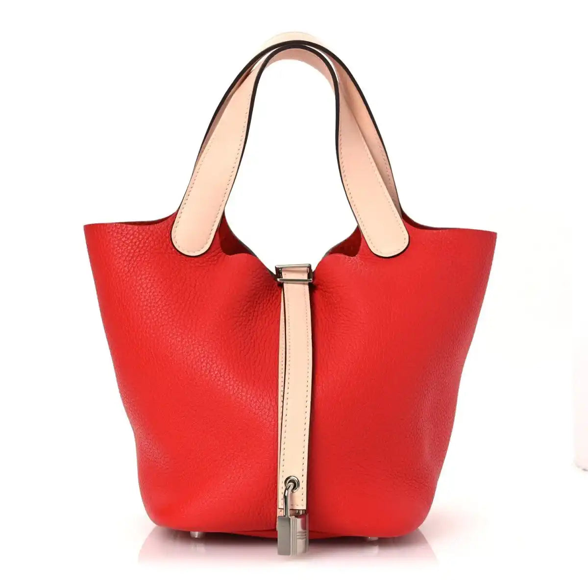 Red pebbled leather tote bag with pale handles and front lock clasp.