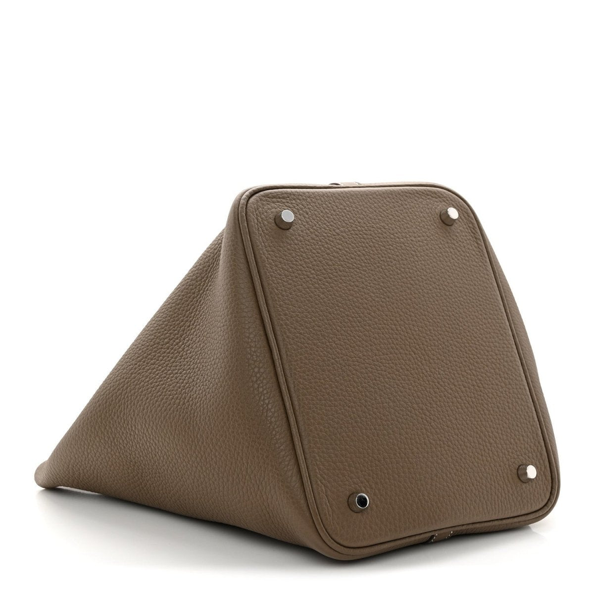 Taupe leather bucket bag with front face, metal eyelets, and top seam stitching.