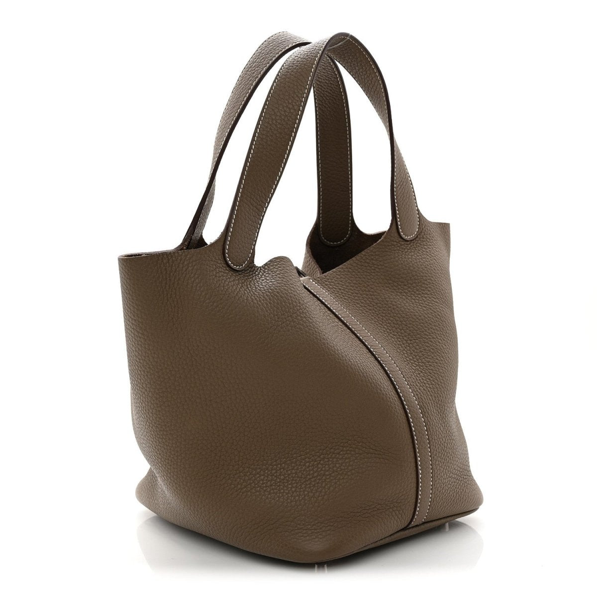 Taupe leather bucket bag with structured silhouette and center lock front panel.