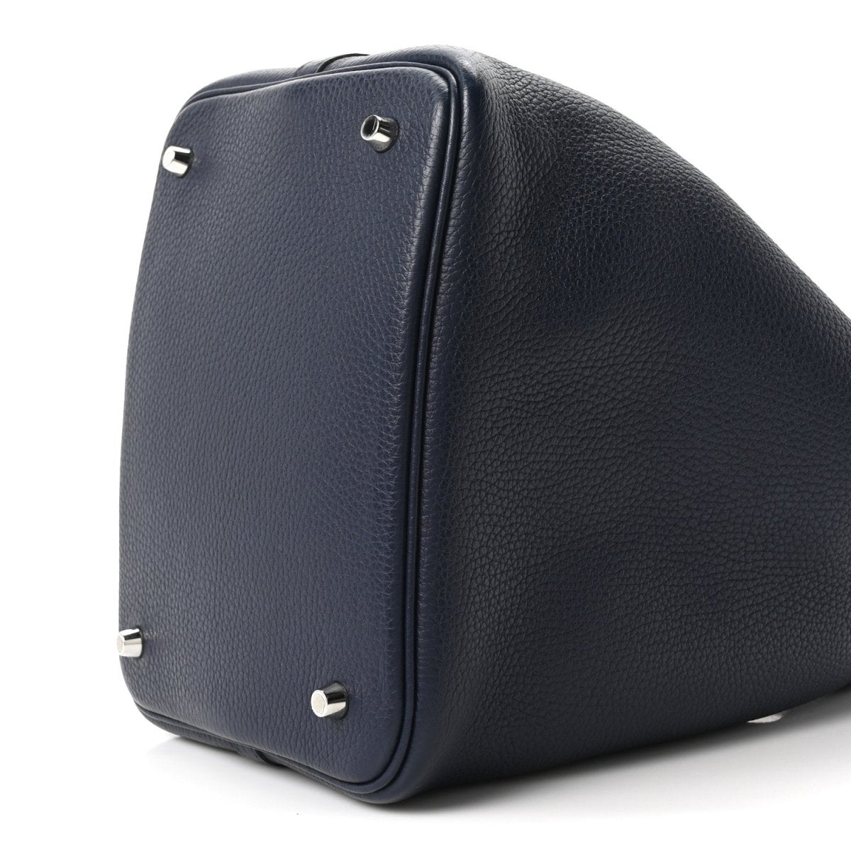 Navy leather bucket bag back/side close-up with metal corner studs
