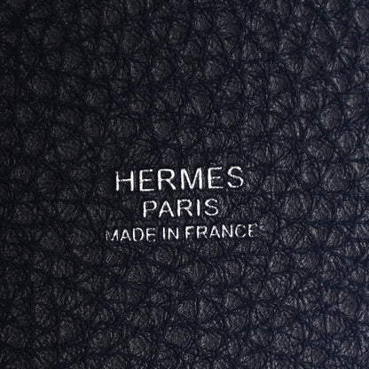 Navy leather close-up with embossed “HERMES PARIS MADE IN FRANCE”