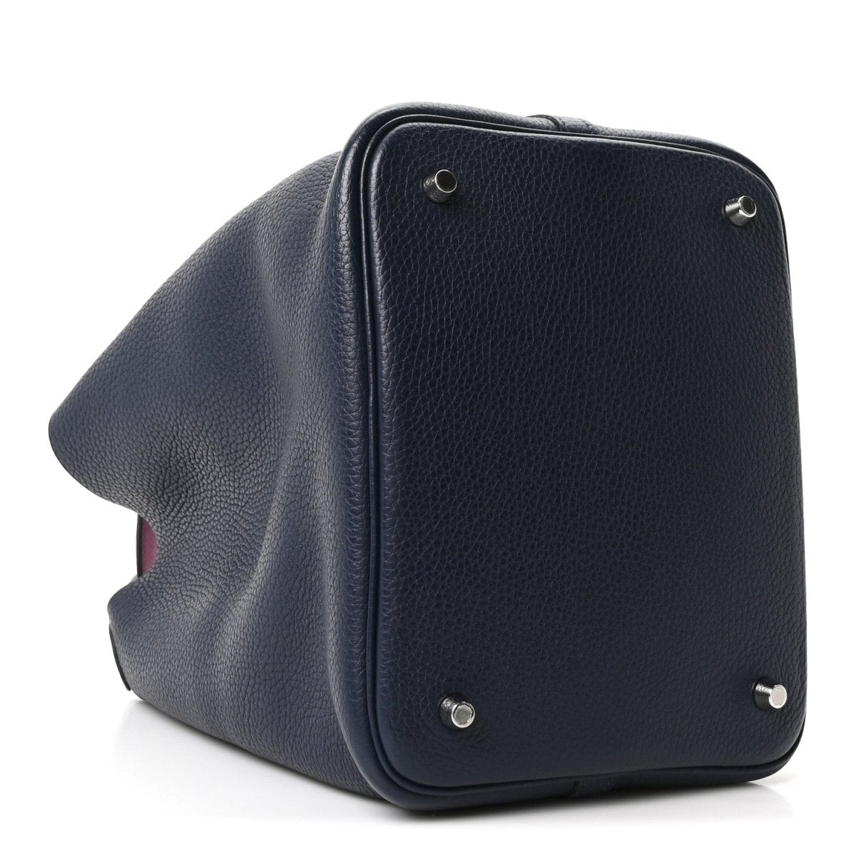 Navy leather bucket bag side view with metal feet and silver hardware